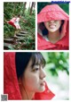 A woman in a red raincoat is posing for a picture.